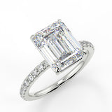 Alya Emerald lab diamond engagement ring. Non-cathedral shank, single row French pave setting band with a 4 prong setting