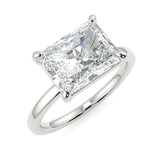 Elongated Radiant lab diamond engagement ring with east-west setting anf plain rounded band. Four prongs.