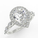 Eva Pear lab diamond engagement ring with cathedral shank and single seamless halo setting with the side marquise diamonds