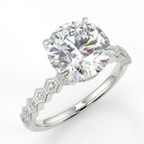 Round cut lab diamond engagement ring with four prongs and honesycomb side stones on band