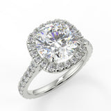 Mimosa Round cut lab diamond engagement ring with a cathedral setting and cushion cut halo. French pave band