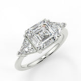 Nirvana Assher Lab diamond engagement ring with three prongs triangle side stones with gallery.