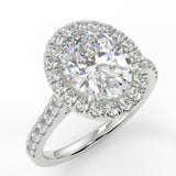 Orchid Oval lab diamond engagement ring with seamless halo, cathedral shank, single row French pave set band with floral under gallery design