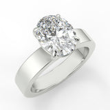 Diamond ring with a white gold band on a light gray background