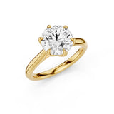 Gold ring with a large diamond on a white background
