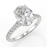 Dantella Oval lab diamond engagement ring with four prongs. Reverse seamless halo, cathedral, single row diamond band with floral basket design.