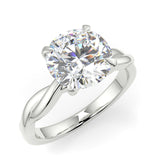 A twisted vine engagement ring with a lab created diamond center stone set in a white gold band