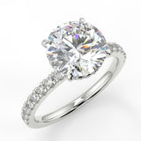 Vera Round cut lab diamond engagement ring with four prongs and french pave band and double reverse halo