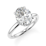 We Oval Diamond Engagement Ring . Non-cathedral plain rounded band setting
With a V-dip reverse halo with an open gallery.