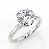 Zara Round cut la diamond engagement ring with four prongs and a cathedral setting