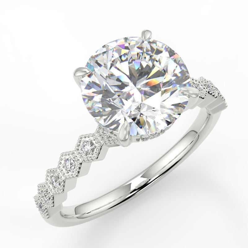 Round cut lab diamond engagement ring with four prongs and honesycomb side stones on band 