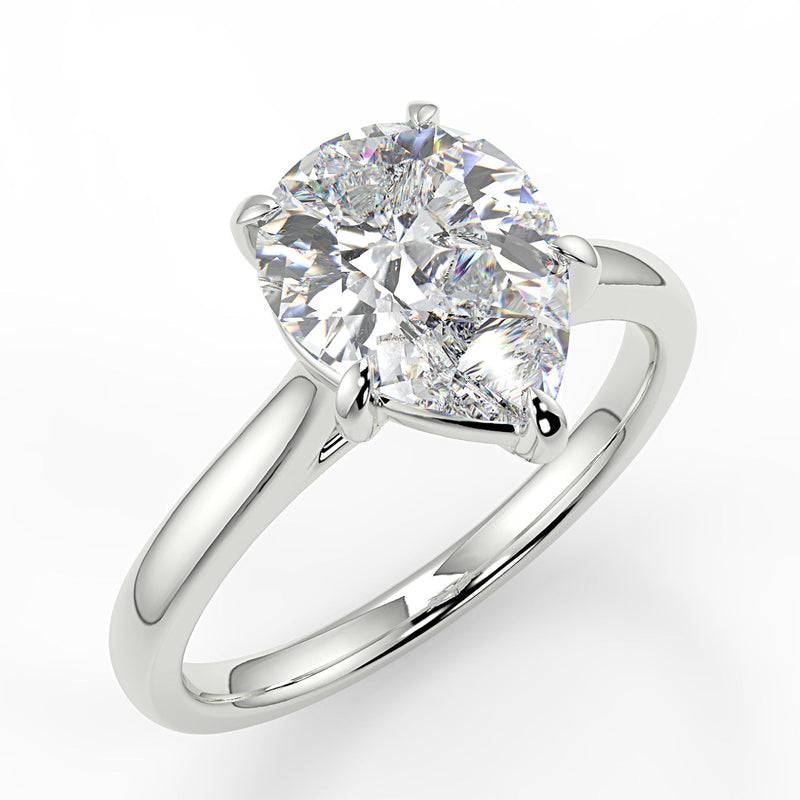 Thalia Pear lab diamond engagement ring with Cathedral shank and plain tapered gold band.