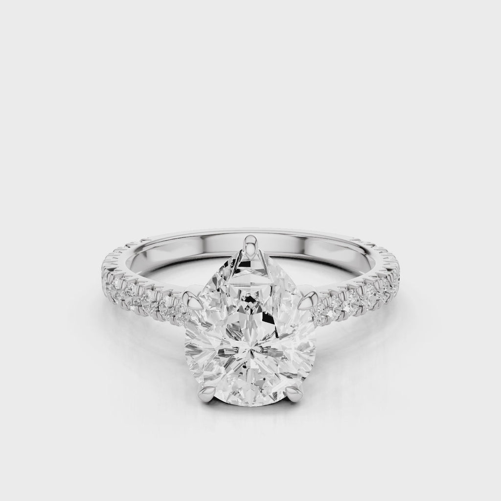 Hazel Pear lab diamon engagement ring with Cathedral shank and Single row French pave setting band video White Gold