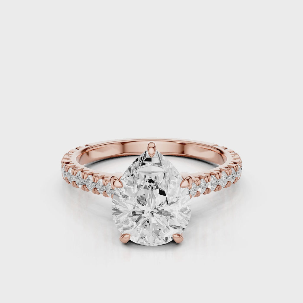 Hazel Pear lab diamon engagement ring with Cathedral shank and Single row French pave setting band video Rose Gold