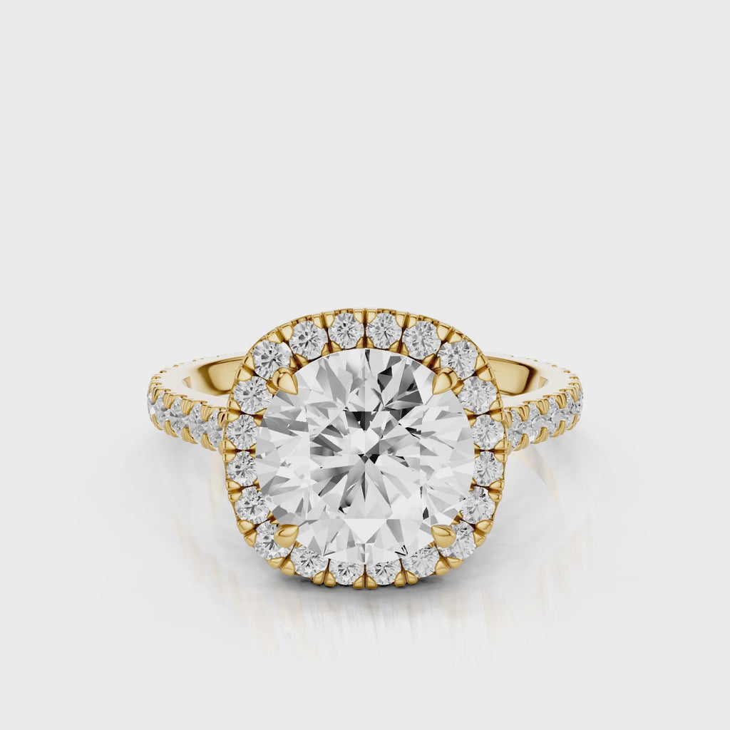 Mimosa Round cut lab diamond engagement ring with a cathedral setting and halo. French pave band video Yellow Gold
