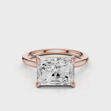 Elongated Radiant lab diamond engagement ring with east-west setting anf plain rounded band. Four prongs.  video  Rose Gold