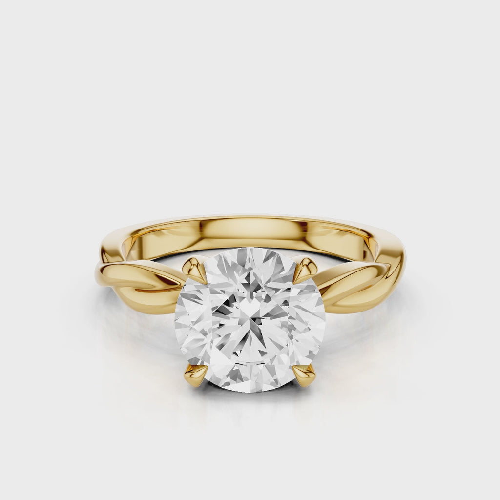 A twisted vine engagement ring with a lab created diamond center stone set in a white gold band video Yellow Gold