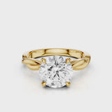 A twisted vine engagement ring with a lab created diamond center stone set in a white gold band video Yellow Gold