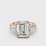 Esti Emerald Engagement Ring with tapered baguettes and cathedral setting and double tiger prongs Rose Gold