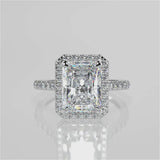 Single seamless halo design for an elongated radiant cut lab created diamond resting atop a single cathedral row. Diamond pave band video 