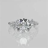 Vega Round cut lab diamond engagement ring with four prongs and Round accent diamonds video 
