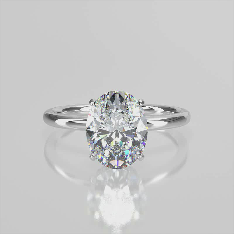  Jacqueline Oval lab diamond engagement ring with plain rounded band setting and a reverse halo 