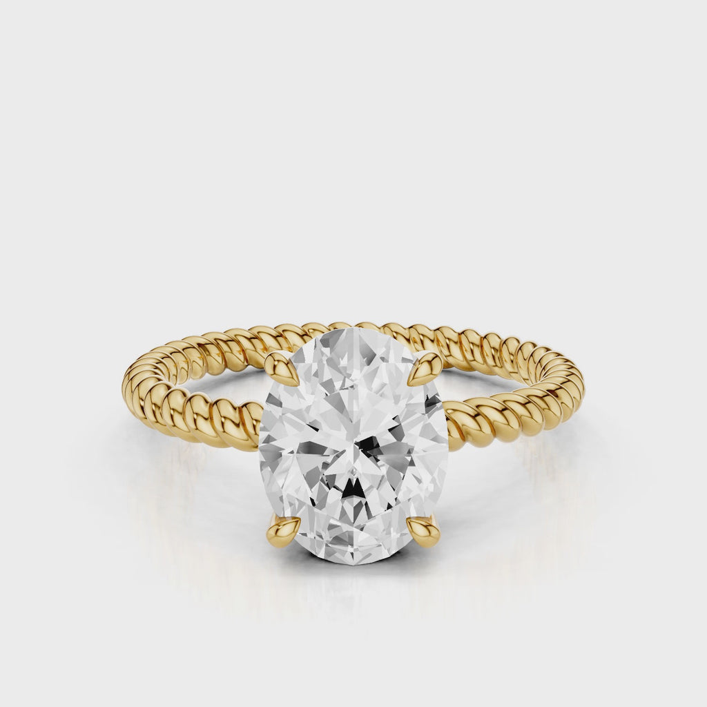 Mia Oval lab diamond engagement ring with four prongs and tristed band video Yellow Gold