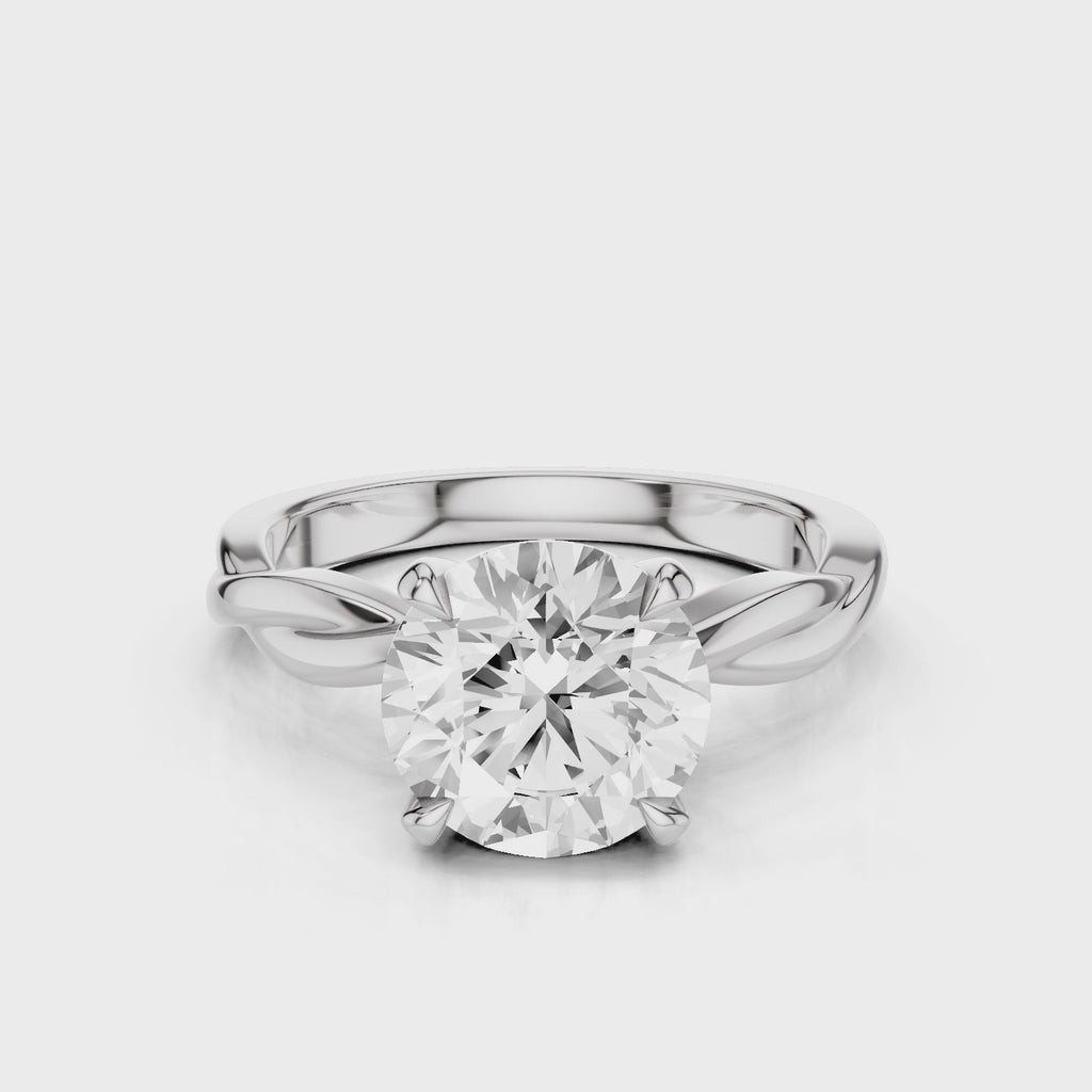 A twisted vine engagement ring with a lab created diamond center stone set in a white gold band video White Gold