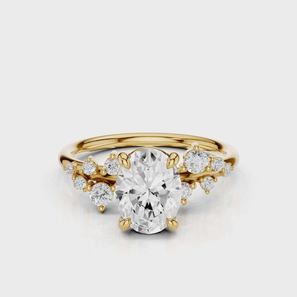April Oval Lab diamond engagement ring with non cathedral setting and round accent stones Yellow Gold