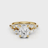 April Oval Lab diamond engagement ring with non cathedral setting and round accent stones Yellow Gold