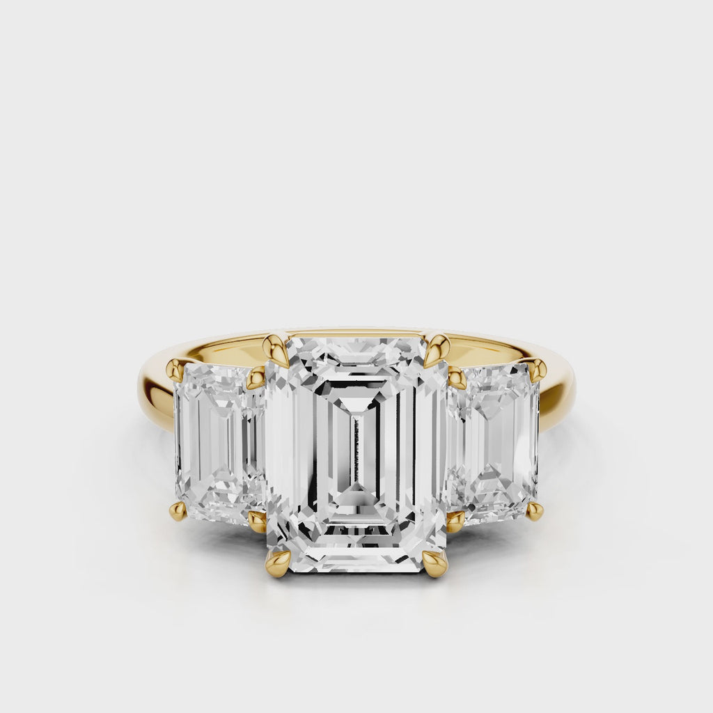 Ophelia Emerald lab diamond engagement ring. Cathedral shank, 3 stone criss cross tapered plain band video Yellow Gold