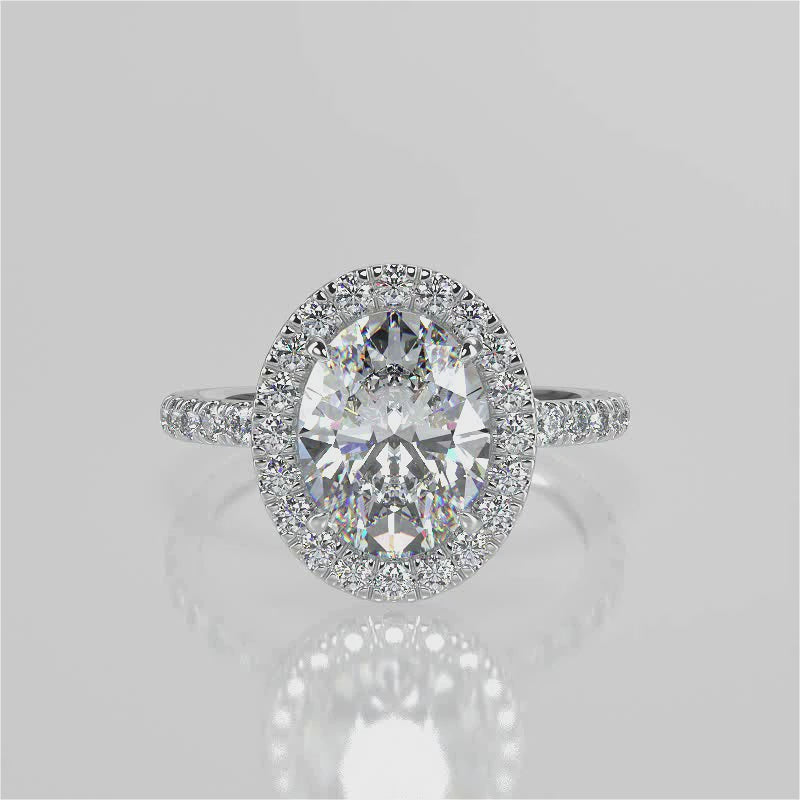 Jazlyn Oval lab diamond engagement ring. Non-cathedral, seamless halo, single row French pave setting band