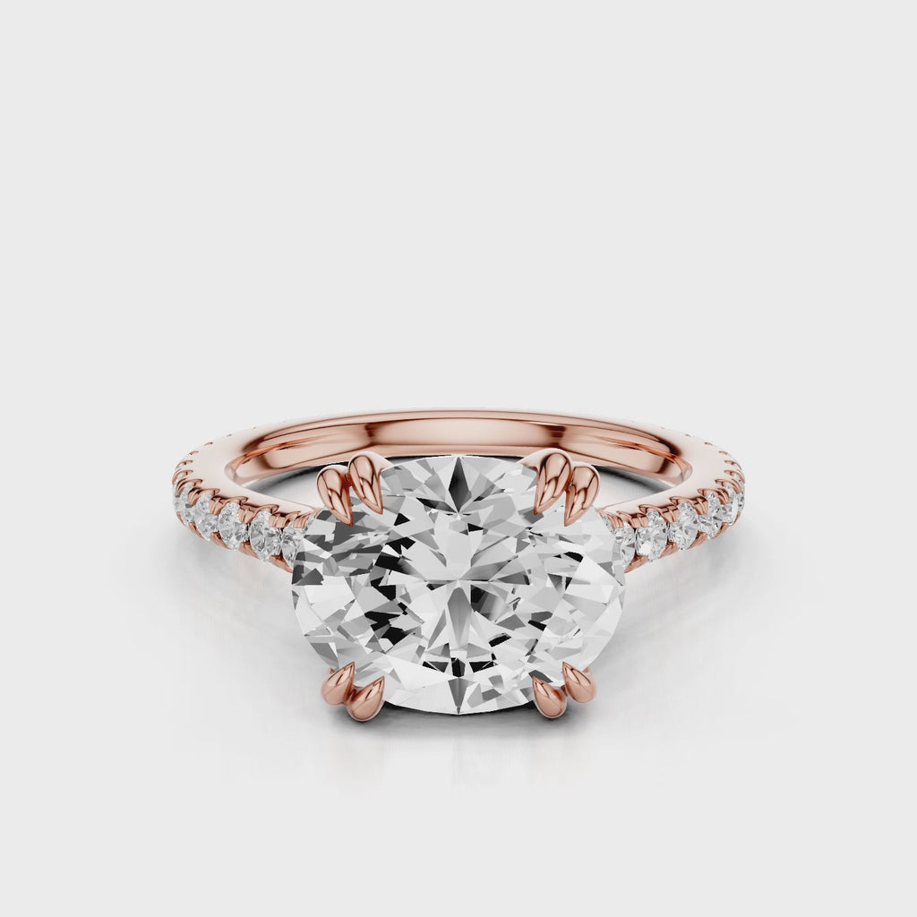 Nailah Oval lab diamond engagement ring in east west setting and tiger claw prongs and a french pave band video Rose Gold