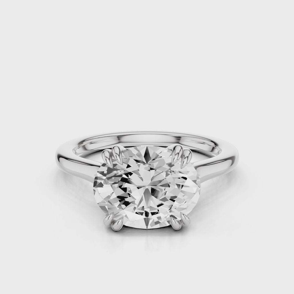 Nailah Oval East West solitaire ring with claw prongs white gold