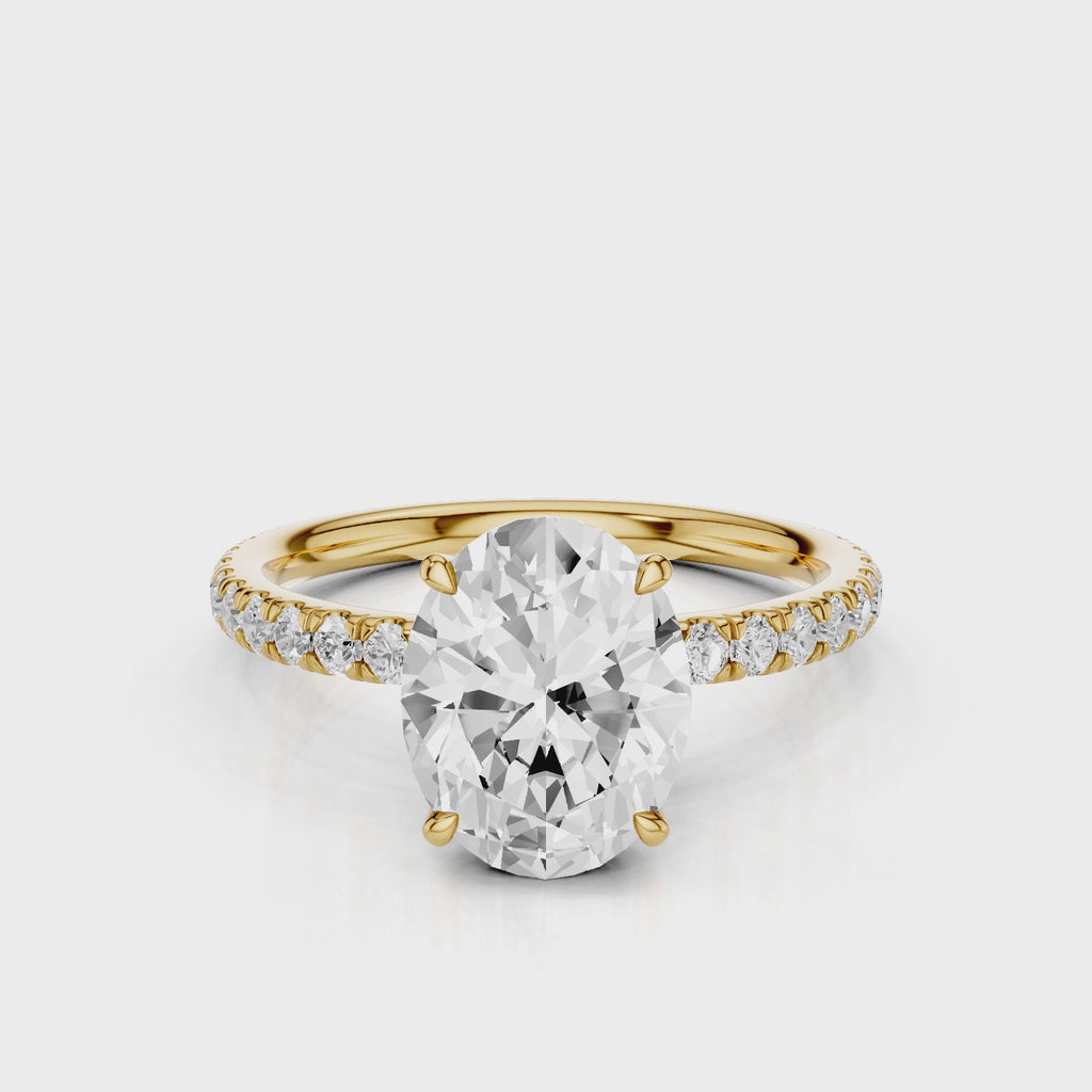 Emma Oval lab diamond engagement ring with four prongs and french pave band video Yellow Gold