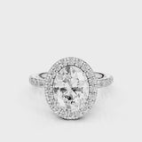 Raquel Oval lab diamond engagement ring. Non-cathedral, double edge seamless halo, single row French pave setting White Gold