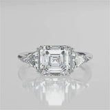 Nirvana Assher  Lab diamond engagement ring with three prongs triangle side stones with gallery video 