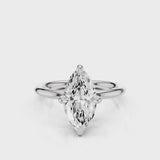 A silver engagement ring with a marquise-shaped lab created colorless centre stone, set in a full cut round brilliant lab grown diamond setting with a reverse halo video  White Gold