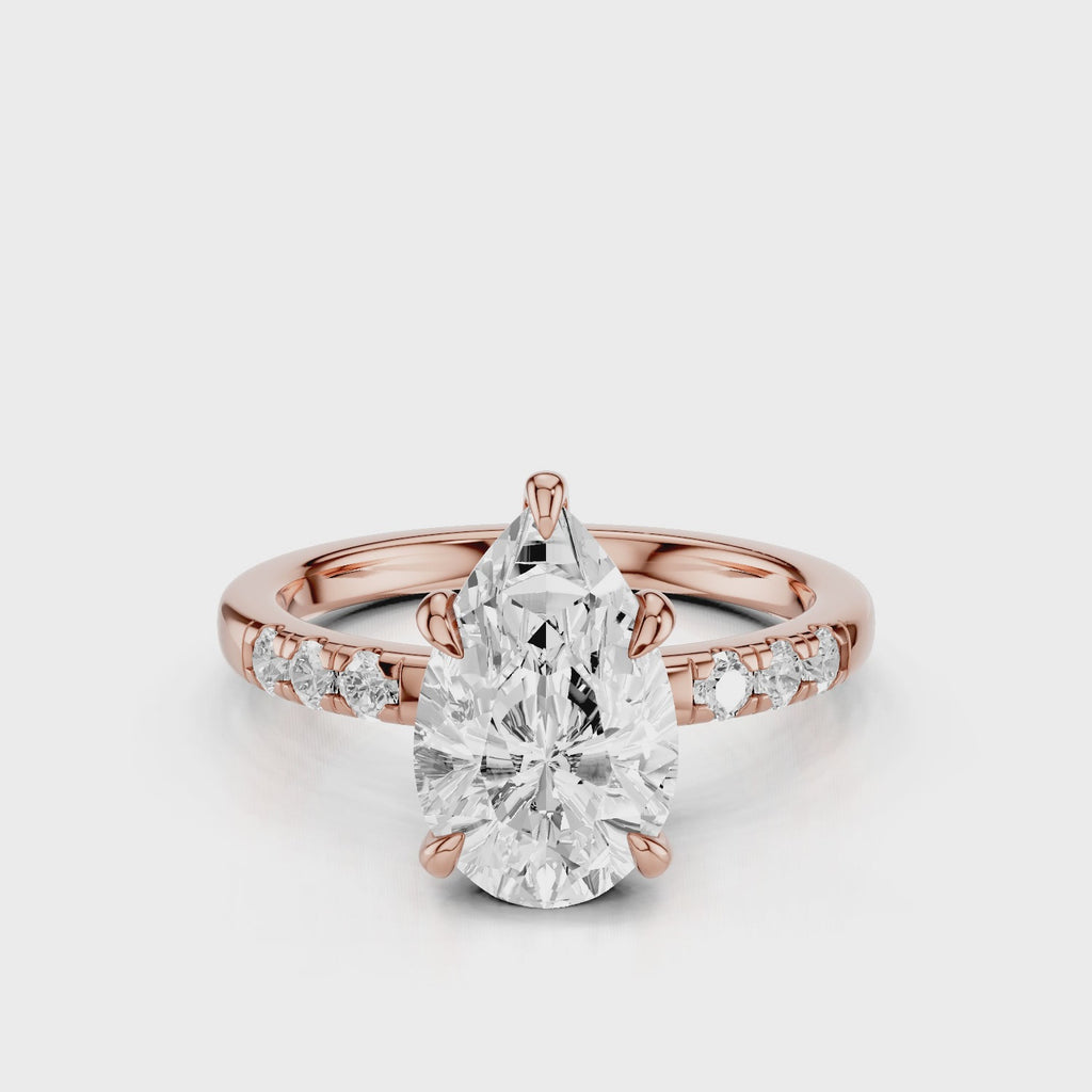 Maida Pear Diamond engagement ring with three accent round side stones on band Rose gold