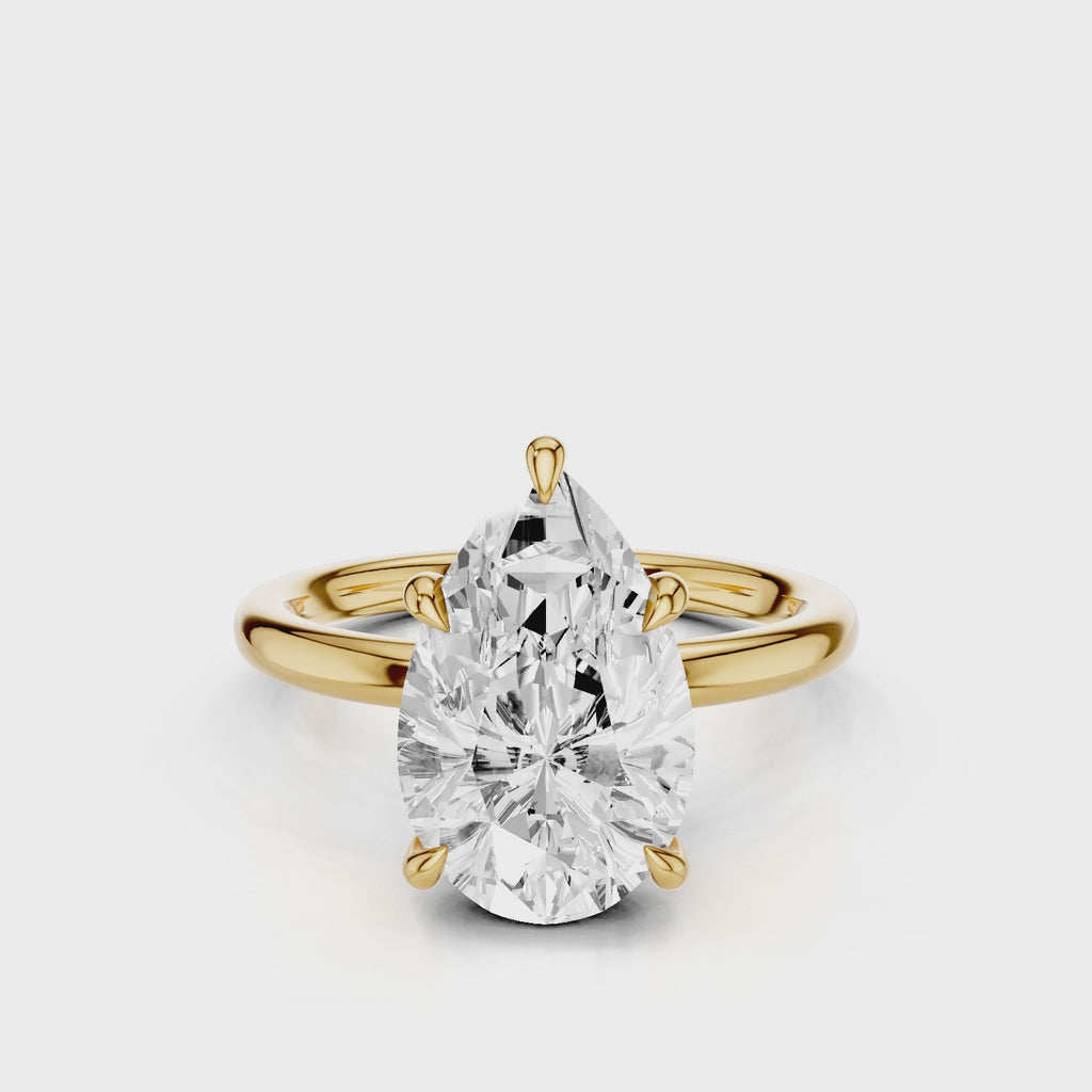 Audrey2 Pear lab diamond with noncathedral setting and plain band yellow gold