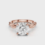 A twisted vine engagement ring with a lab created diamond center stone set in a white gold band video Rose Gold