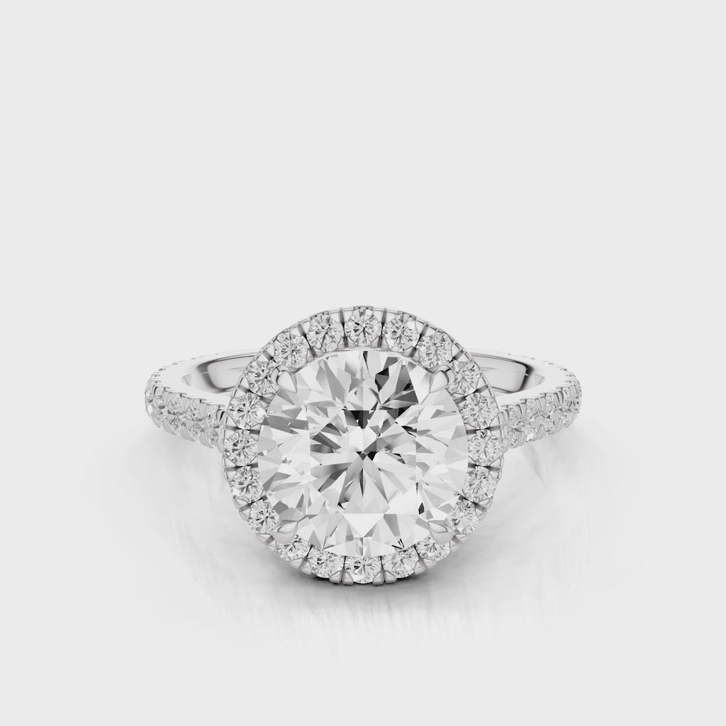 Milena Round cut lab diamond engagement ring. Seamless halo cathedral setting, French pave diamond band video White Gold