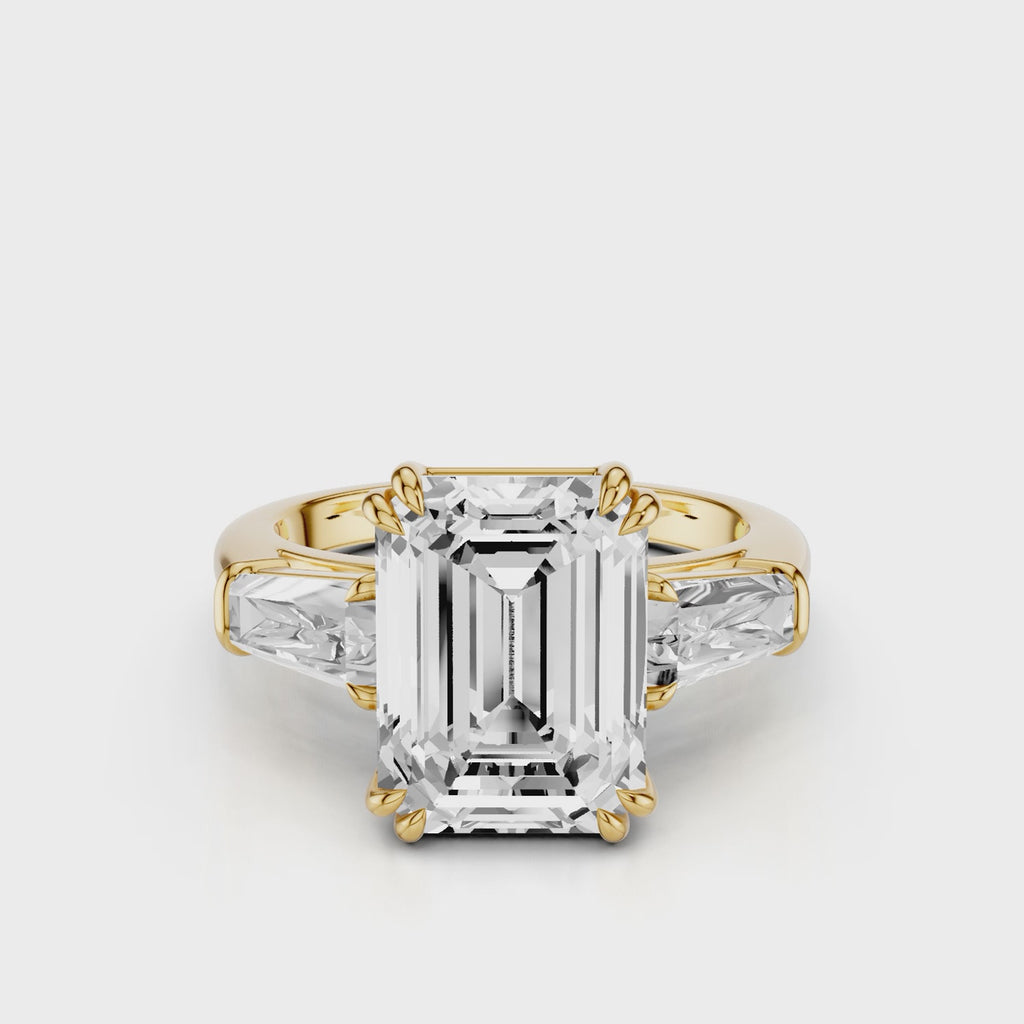 Esti Emerald Engagement Ring with tapered baguettes and cathedral setting and double tiger prongs Yellow Gold