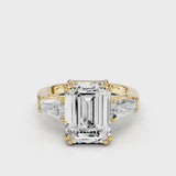 Esti Emerald Engagement Ring with tapered baguettes and cathedral setting and double tiger prongs Yellow Gold
