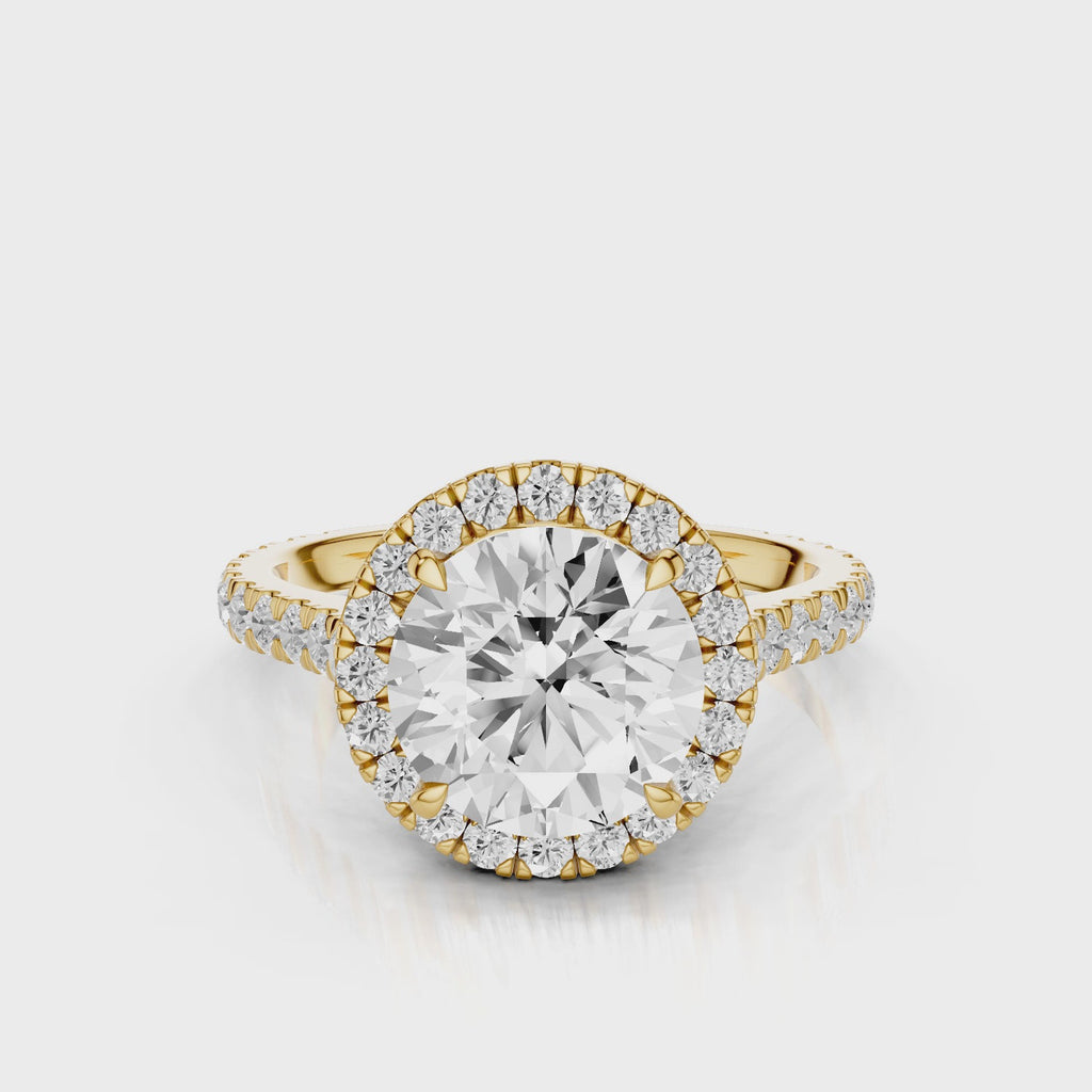 Milena Round cut lab diamond engagement ring. Seamless halo cathedral setting, French pave diamond band video Yellow Gold