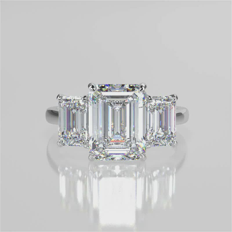 Ophelia Emerald lab diamond engagement ring. Cathedral shank, 3 stone criss cross tapered plain band video 