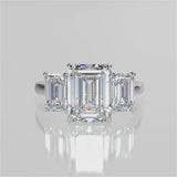Ophelia Emerald lab diamond engagement ring. Cathedral shank, 3 stone criss cross tapered plain band video 