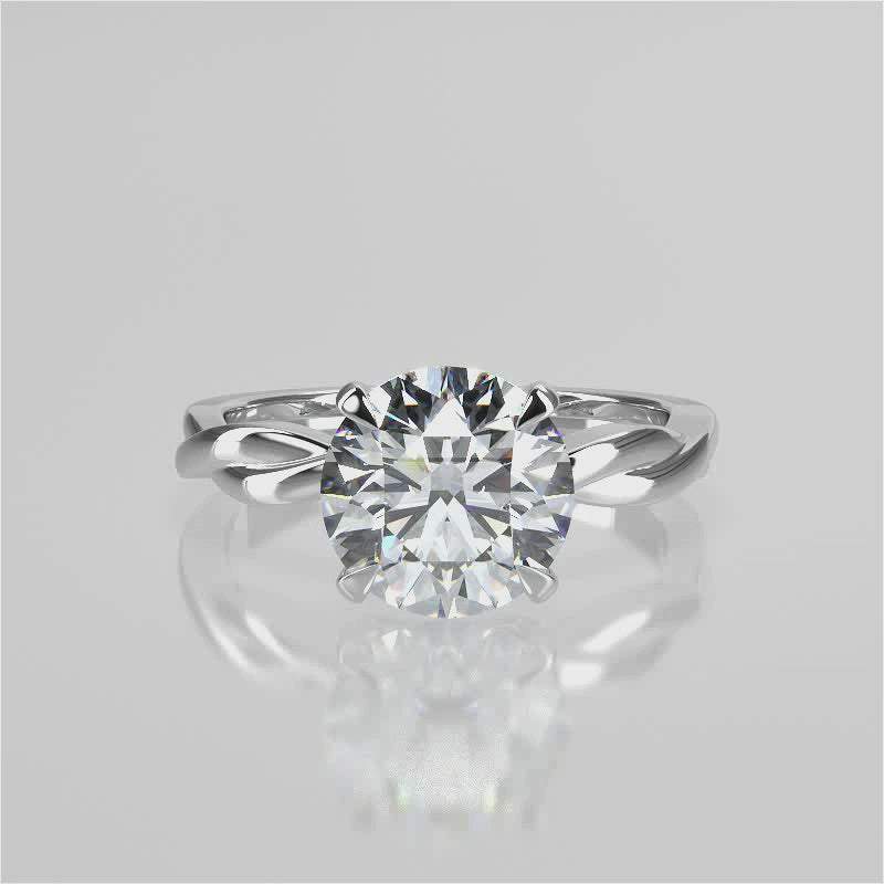 A twisted vine engagement ring with a lab created diamond center stone set in a white gold band video 