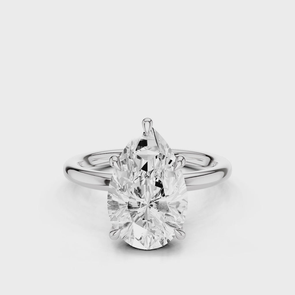 Audrey2 Pear Moissanite Engagement ring with plain band and non-cathedral reverse Halo White Gold 