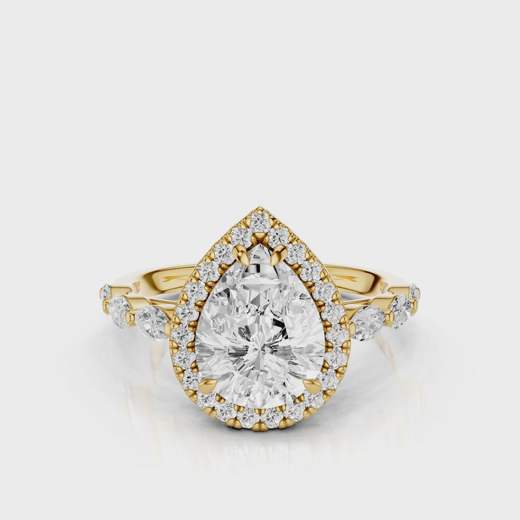 Eva Pear lab diamond engagement ring with cathedral shank and single seamless halo setting with the side marquise diamonds video Yellow Gold